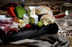 Mix Cheese On Dark Background On Wood Board With Grapes, Honey, Nuts, Tomatoes And Basil. Top View Stock Image Mix Cheese On Dark Background On Wood Board With Grapes, Honey, Nuts, Tomatoes And Basil. Top View Stock Image