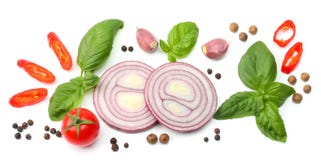 Mix of slice of tomato, red onion, basil leaf, garlic and spices isolated on white background. top view stock image Mix of slice of tomato, red onion, basil leaf, garlic and spices isolated on white background. top view stock image