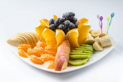 Mixed fruit in white plate on white background - Healthy food style stock photos Mixed fruit in white plate on white background - Healthy food style stock photos