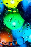 Mixing water and oil on a beautiful color abstract background gradient balls circles and ovals royalty free stock images Mixing water and oil on a beautiful color abstract background gradient balls circles and ovals royalty free stock images