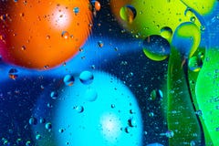 Mixing water and oil on a beautiful color abstract background gradient balls circles and ovals royalty free stock image Mixing water and oil on a beautiful color abstract background gradient balls circles and ovals royalty free stock image
