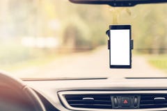 Mobile Phone With Blank Screen In Car Windshield Holder Stock Images
