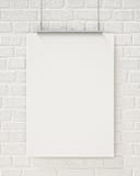 Mock up blank poster hanging on the white brick wall, background