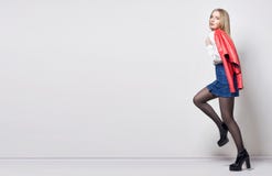 Mockup Beautiful blond woman in shirt and skirt. Girl with perfect body posing standing. Beautiful long hair and legs, smooth stock images Mockup Beautiful blond woman in shirt and skirt. Girl with perfect body posing standing. Beautiful long hair and legs, smooth stock images