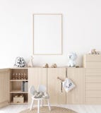 Mockup frame in minimal unisex child bedroom with natural wooden furniture