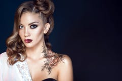 Model with artistic make up and hairstyle. Body art on her shoulder. Ideal woman concept stock photography Model with artistic make up and hairstyle. Body art on her shoulder. Ideal woman concept stock photography
