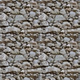Modelo inconsútil del azulejo de una pared de piedra imagenes de archivo Modelo inconsútil del azulejo de una pared de piedra imagenes de archivo