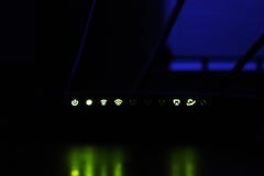 Modem for the Internet. Burning lights on the router stock photos Modem for the Internet. Burning lights on the router stock photos