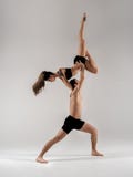 Modern ballet dancer couple in black form performing art jump with empty copy space background, izolated stock photos Modern ballet dancer couple in black form performing art jump with empty copy space background, izolated stock photos