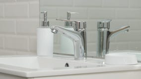 Modern Bathroom Picture with Sink and Faucet with Flowing Water royalty free stock photo Modern Bathroom Picture with Sink and Faucet with Flowing Water royalty free stock photo