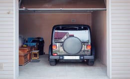 Modern Car In The Garage, Rear View. Royalty Free Stock Photos