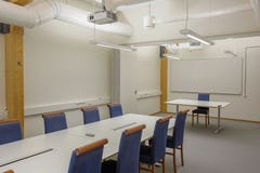 Modern conference / meeting room isolated. White office table and blue chairs. Business concept. Modern office style. Stock Photos Modern conference / meeting room isolated. White office table and blue chairs. Business concept. Modern office style. Stock Photos