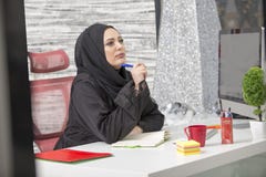 Modern female Arabian office worker in office stock image Modern female Arabian office worker in office stock image