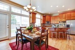 Modern kitchen room with island and dining area stock images Modern kitchen room with island and dining area stock images