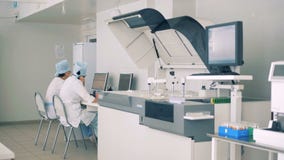 Modern Laboratory interior. Scientists works with lab equipment, computers. stock video footage Modern Laboratory interior. Scientists works with lab equipment, computers. stock video footage