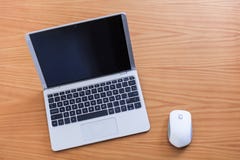 Laptop with mouse over wood table stock photo Laptop with mouse over wood table stock photo