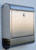 Modern letterbox metal. Modern post box made of metal with paper roll royalty free stock image Modern letterbox metal. Modern post box made of metal with paper roll royalty free stock image