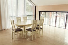Modern lights apartment with a dining table. royalty free stock photo Modern lights apartment with a dining table. royalty free stock photo