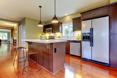 Modern new brown kitchen with cherry floor. Royalty Free Stock Photography Modern new brown kitchen with cherry floor. Royalty Free Stock Photography