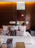 Modern room with colourful Asian sofa couch, fabric pillows and Ceiling lamp royalty free stock photography Modern room with colourful Asian sofa couch, fabric pillows and Ceiling lamp royalty free stock photography