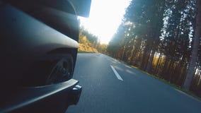 Modern scrambler motorbike on the forest road riding. having fun driving the empty road stock video Modern scrambler motorbike on the forest road riding. having fun driving the empty road stock video