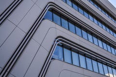 Modern and unusual architecture from metal and glass. Non-standard forms and decisions. Lines and geometry of the big building. stock image Modern and unusual architecture from metal and glass. Non-standard forms and decisions. Lines and geometry of the big building. stock image