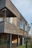 Modern wooden building under blue sky. Modern wooden building under a blue sky Stock Image Modern wooden building under blue sky. Modern wooden building under a blue sky Stock Image