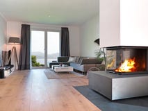 Moderne woonkamer met brandplaats royalty-vrije stock foto Moderne woonkamer met brandplaats royalty-vrije stock foto