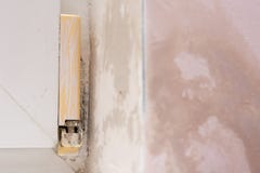 Mold by the window in the household. Bad ventilation in a detached house royalty free stock image Mold by the window in the household. Bad ventilation in a detached house royalty free stock image