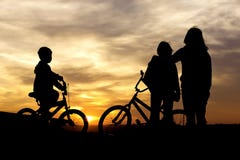Mom And Kids Bond At Sunset. Royalty Free Stock Images