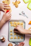 Mom and daughter are playing bakery. Prepare homemade cookies with dough berries royalty free stock photos Mom and daughter are playing bakery. Prepare homemade cookies with dough berries royalty free stock photos