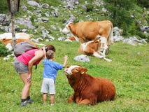 Mom and kid enjoy mountain nature in summer season