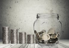 Money Jar with coins on wooden background royalty free stock photos Money Jar with coins on wooden background royalty free stock photos