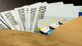 Money usb security key in envelope on black background notepad stock photos Money usb security key in envelope on black background notepad stock photos