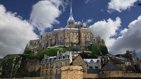 Mont Saint-Michel, Normandy, France--one of the most visited tourist sites in France. Designated as one of the first UNESCO World stock footage Mont Saint-Michel, Normandy, France--one of the most visited tourist sites in France. Designated as one of the first UNESCO World stock footage