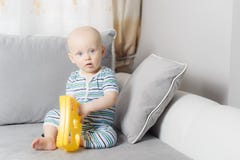 6-month baby boy crying while mother is changing his nappy stock image 6-month baby boy crying while mother is changing his nappy stock image