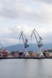 Monumental Cranes in Shipyard, surrounding the city. stock photos Monumental Cranes in Shipyard, surrounding the city. stock photos