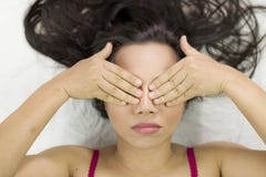 Moody asian women lying on ground with black long hair. acting upset, and showing close her eyes stock images Moody asian women lying on ground with black long hair. acting upset, and showing close her eyes stock images