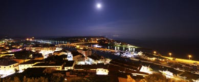 Moon and night view on the city `Castiglione della Pescaia`. royalty free stock photography Moon and night view on the city `Castiglione della Pescaia`. royalty free stock photography