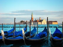 Moored gondolas and San Giorgio di Maggiore stock images Moored gondolas and San Giorgio di Maggiore stock images