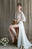 Morning beautiful delicate bride with short hair with a small wreath silk underwear sitting on a chair with a wedding bouquet