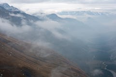 Mountain ranges partly engulfed in clouds royalty free stock photos Mountain ranges partly engulfed in clouds royalty free stock photos