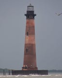 Morris Island Light galenskapstrandSC royaltyfria bilder Morris Island Light galenskapstrandSC royaltyfria bilder