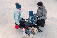Moscow, Park in Mitino, January 4, 2017: a Young family with children and a dog on vacation in winter royalty free stock images Moscow, Park in Mitino, January 4, 2017: a Young family with children and a dog on vacation in winter royalty free stock images