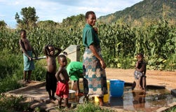 Mother And Sons By A Fountain In Africa Stock Images Mother And Sons By A Fountain In Africa Stock Images