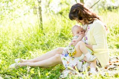 Mother breast feeding baby outdoors royalty free stock photography Mother breast feeding baby outdoors royalty free stock photography