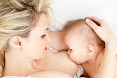Mother breast feeding her child stock image Mother breast feeding her child stock image