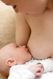 Mother breast feeding her little son