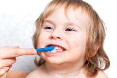 Mother brushing teeth baby boy kid 2 years stock photography Mother brushing teeth baby boy kid 2 years stock photography