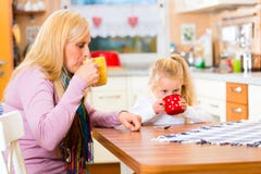 Mother and child drinking milk in kitchen Stock Image Mother and child drinking milk in kitchen Stock Image